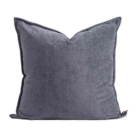Leather Gallery Obelisk Cushion in Shadow Grey, featuring textured grey fabric with piped edges.
