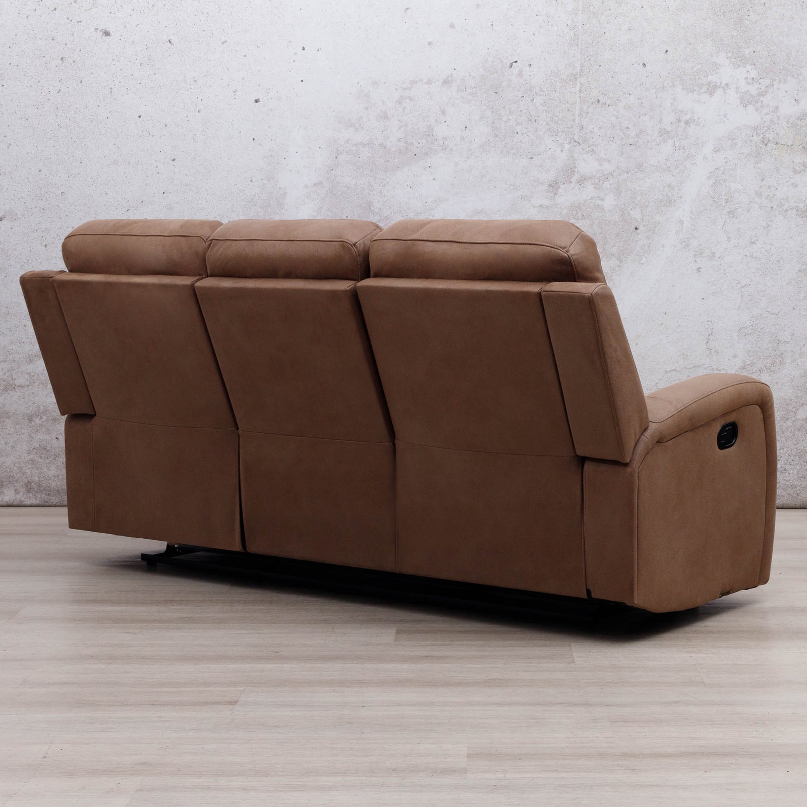 Rear three-quarter view of the Leather Gallery Orlando 3 Seater Fabric Recliner in Desert Sand, showing its textured fabric upholstery and reclining design.