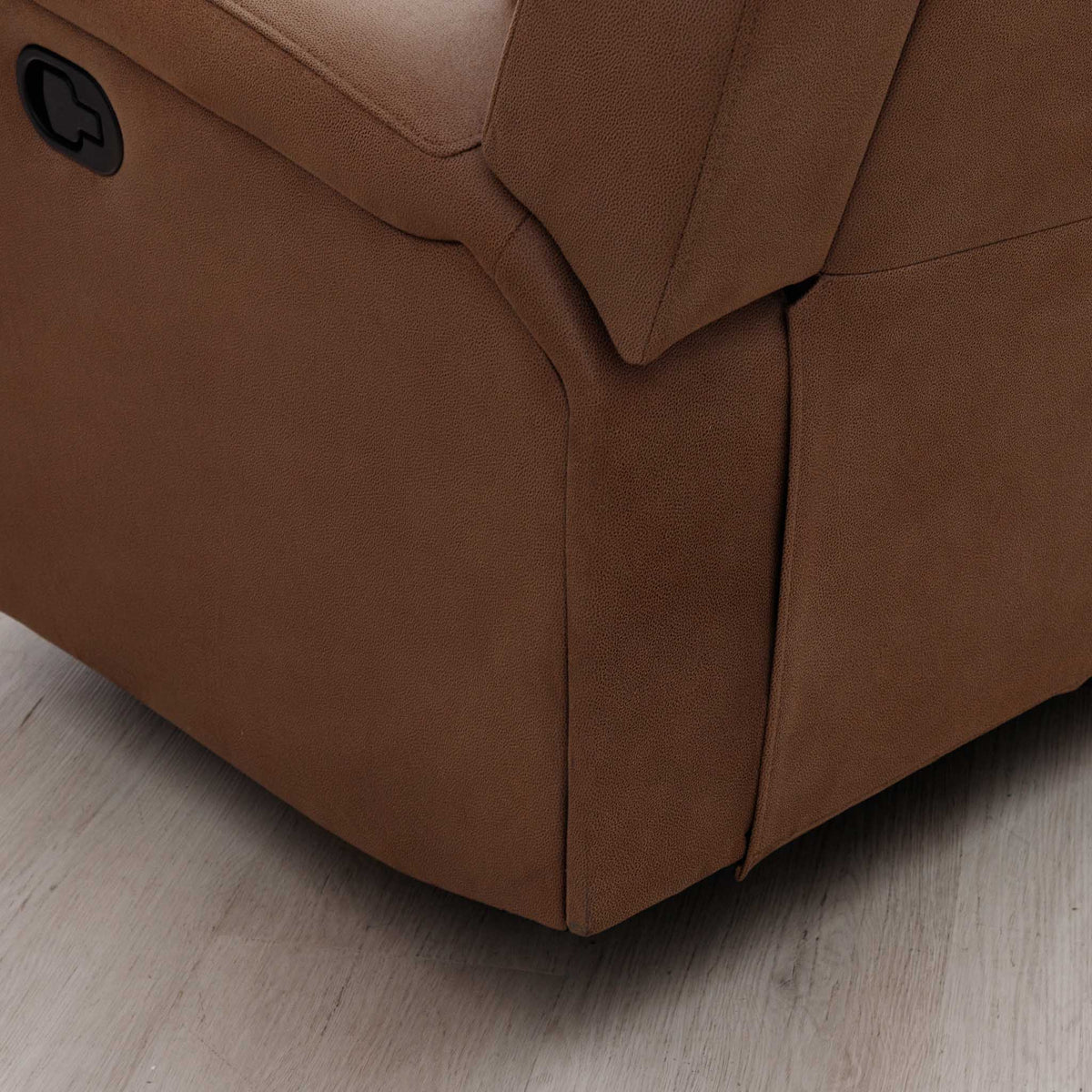 Close-up of the Leather Gallery Orlando 1 Seater Fabric Recliner in Desert Sand, showing the side panel, armrest, and black recliner control button.