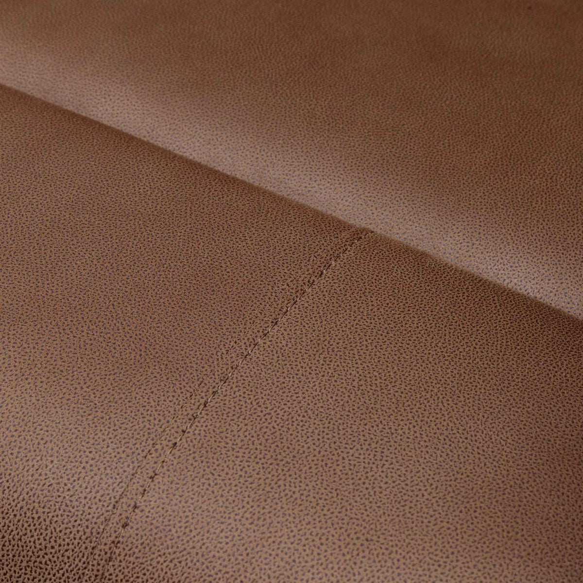Close-up of the Leather Gallery Orlando 1 Seater Fabric Recliner in Desert Sand, showing the textured upholstery and diagonal stitched seam.
