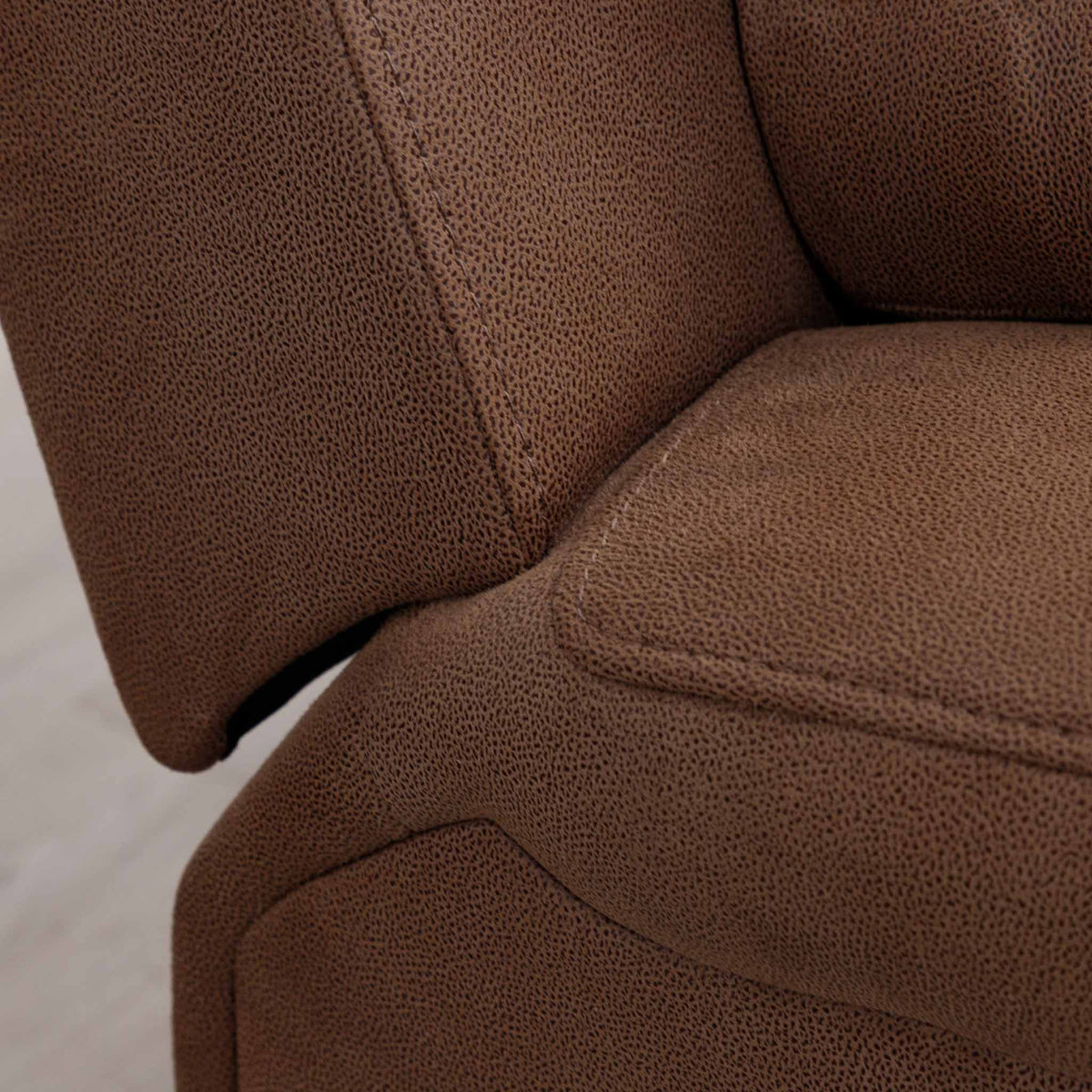Close-up of the Leather Gallery Orlando 1 Seater Fabric Recliner in Desert Sand, showing the textured fabric grain and seat and armrest detail.