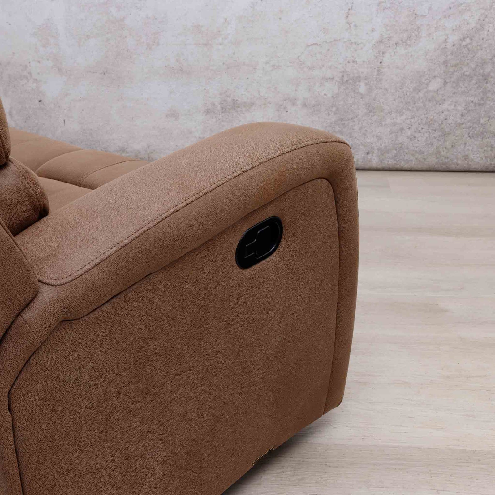 Close-up of the Leather Gallery Orlando 3 Seater Fabric Recliner in Desert Sand, showing the side panel, armrest, and black recliner control button.
