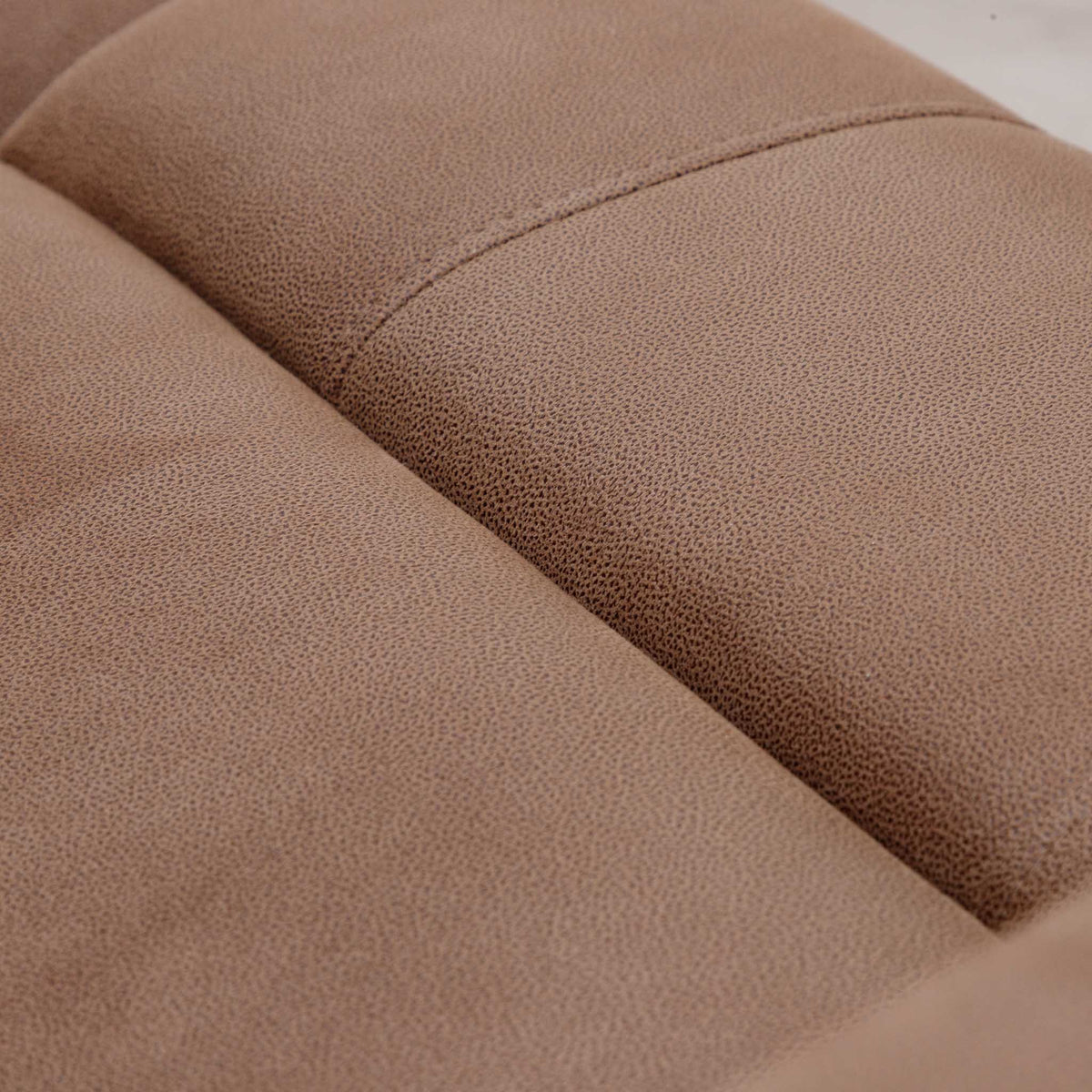 Close-up of the Leather Gallery Orlando 3 Seater Fabric Recliner in Desert Sand, showing the curved seam and fine textured upholstery.