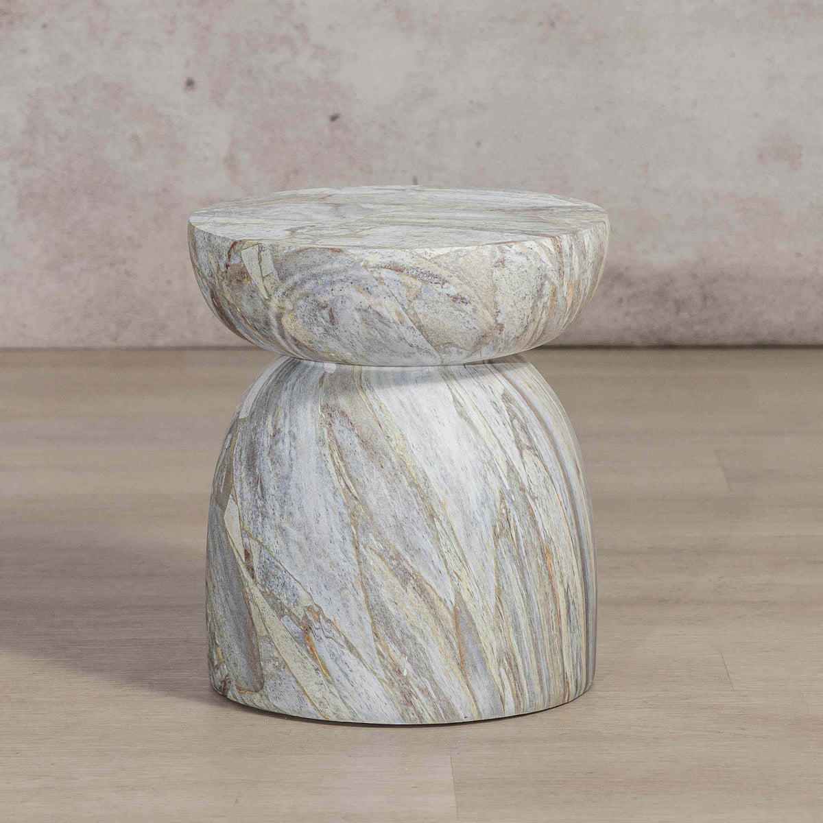 Gallery Everyday Ostia Side Table in Aqua Mist, featuring a round stone top and sculptural pedestal base with a blue-grey and cream finish.