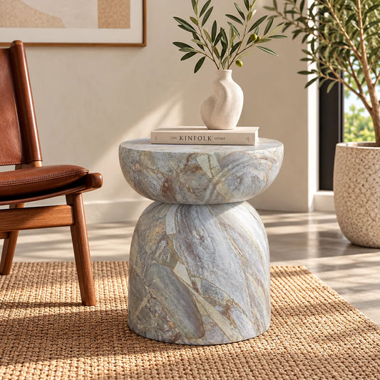 Gallery Everyday Ostia Side Table in Aqua Mist, featuring a round stone top and sculptural pedestal base with a blue-grey and cream finish.