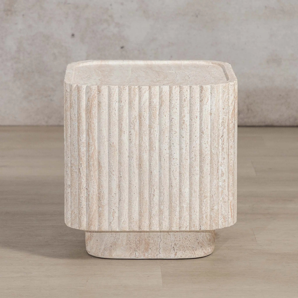 Gallery Everyday Serra Side Table in Seashell, featuring a cream stone finish with fluted detailing and a tiered base.