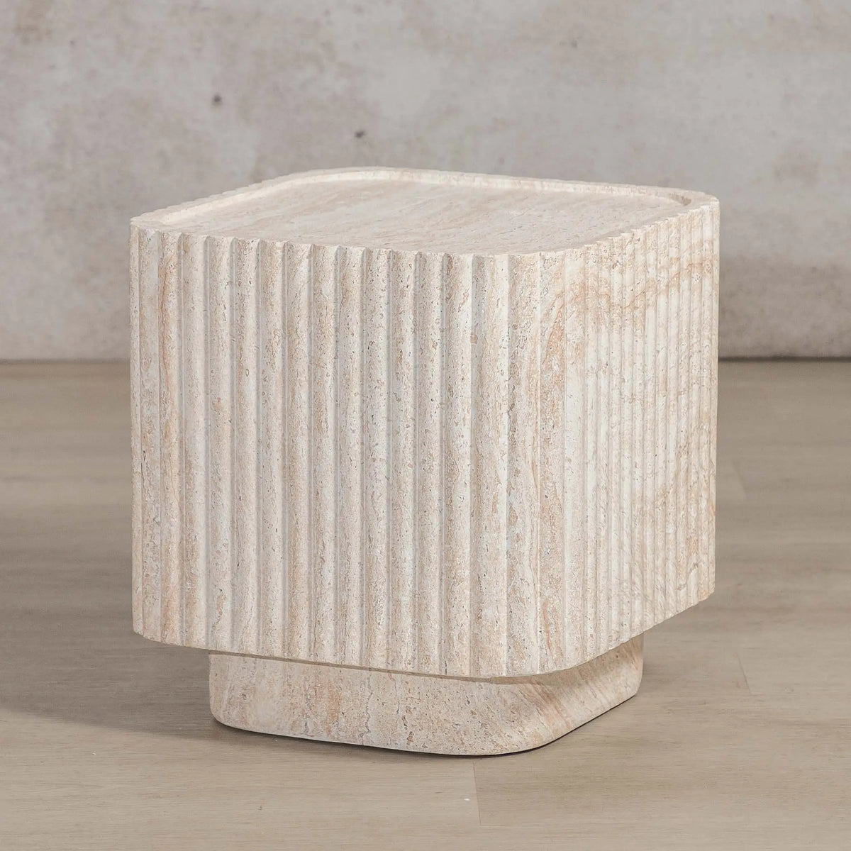 Gallery Everyday Serra Side Table in Seashell, featuring a cream stone finish with fluted detailing and a tiered base.