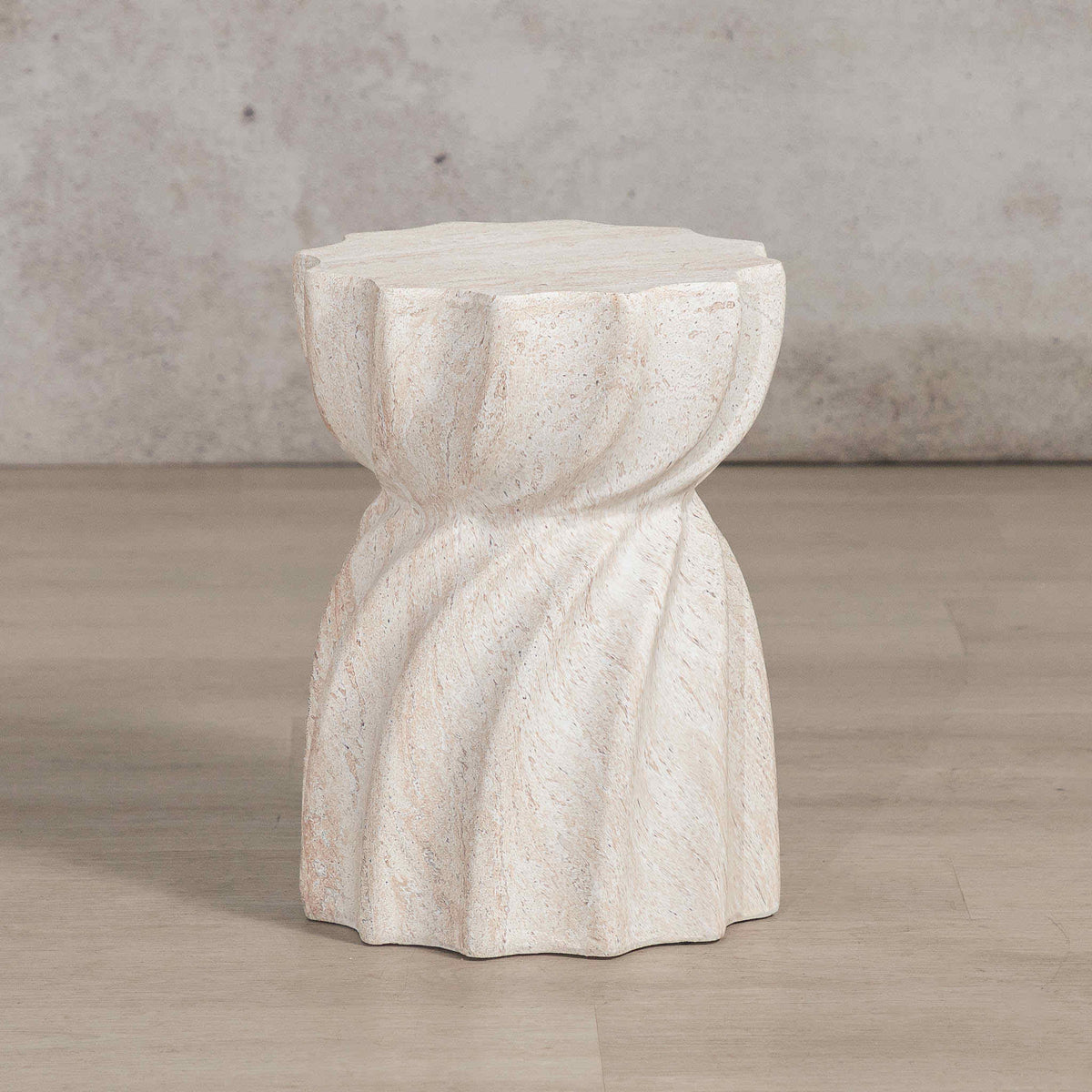 Gallery Everyday Terrena Side Table in Seashell, featuring a sculptural twisted form with a warm cream travertine-look finish.