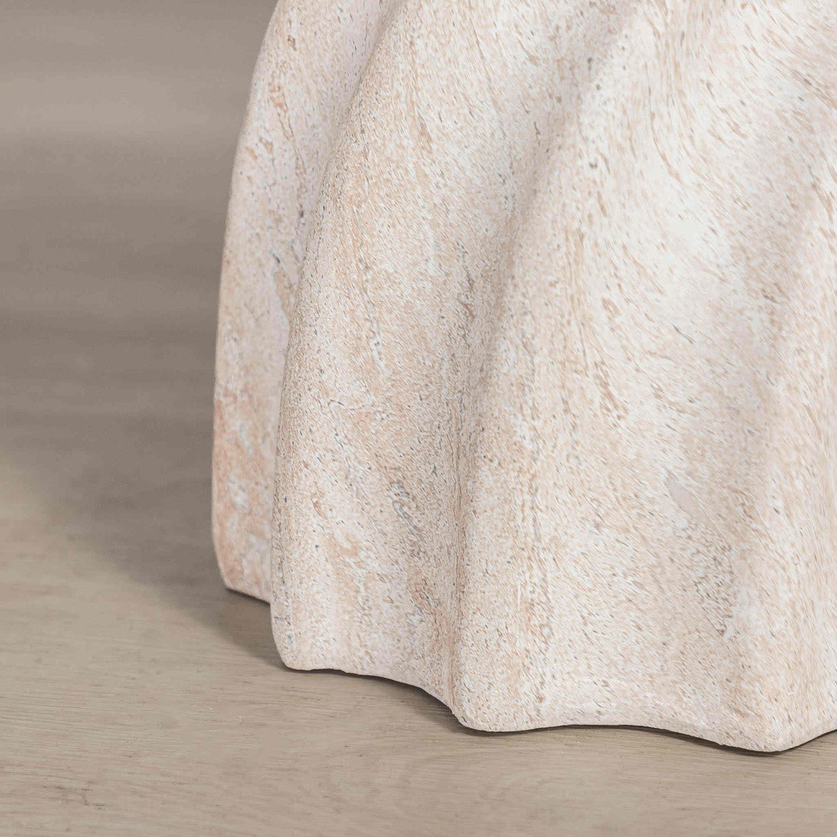 Gallery Everyday Terrena Side Table in Seashell, featuring a sculptural twisted form with a warm cream travertine-look finish.