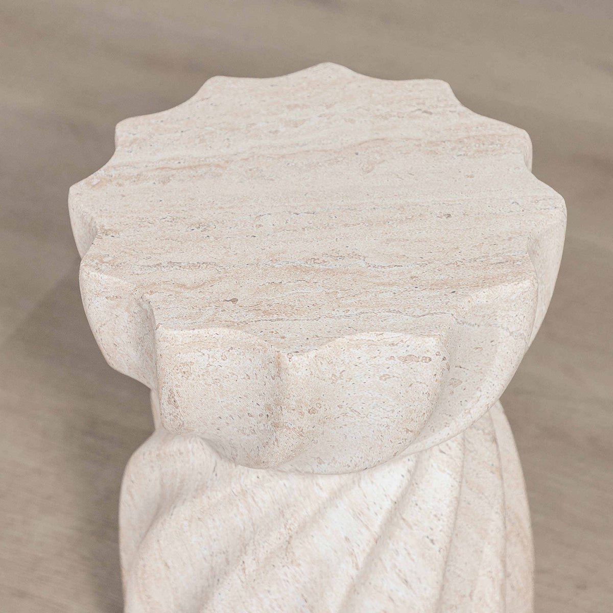 Gallery Everyday Terrena Side Table in Seashell, featuring a sculptural twisted form with a warm cream travertine-look finish.