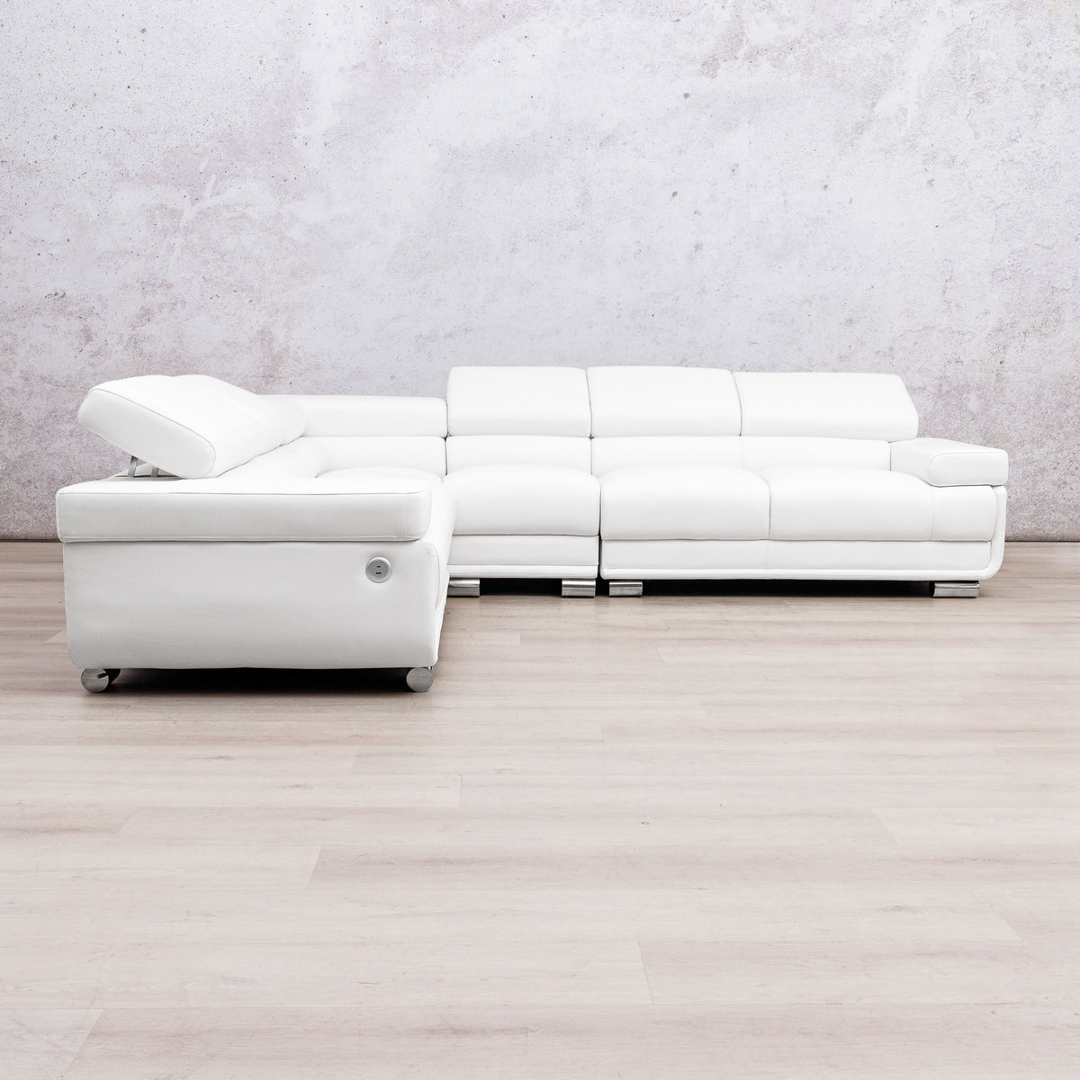Leather Gallery Tobago 5 Seater L Shape sectional sofa in white leather with a left-facing chaise, against a light grey wall and wood flooring.