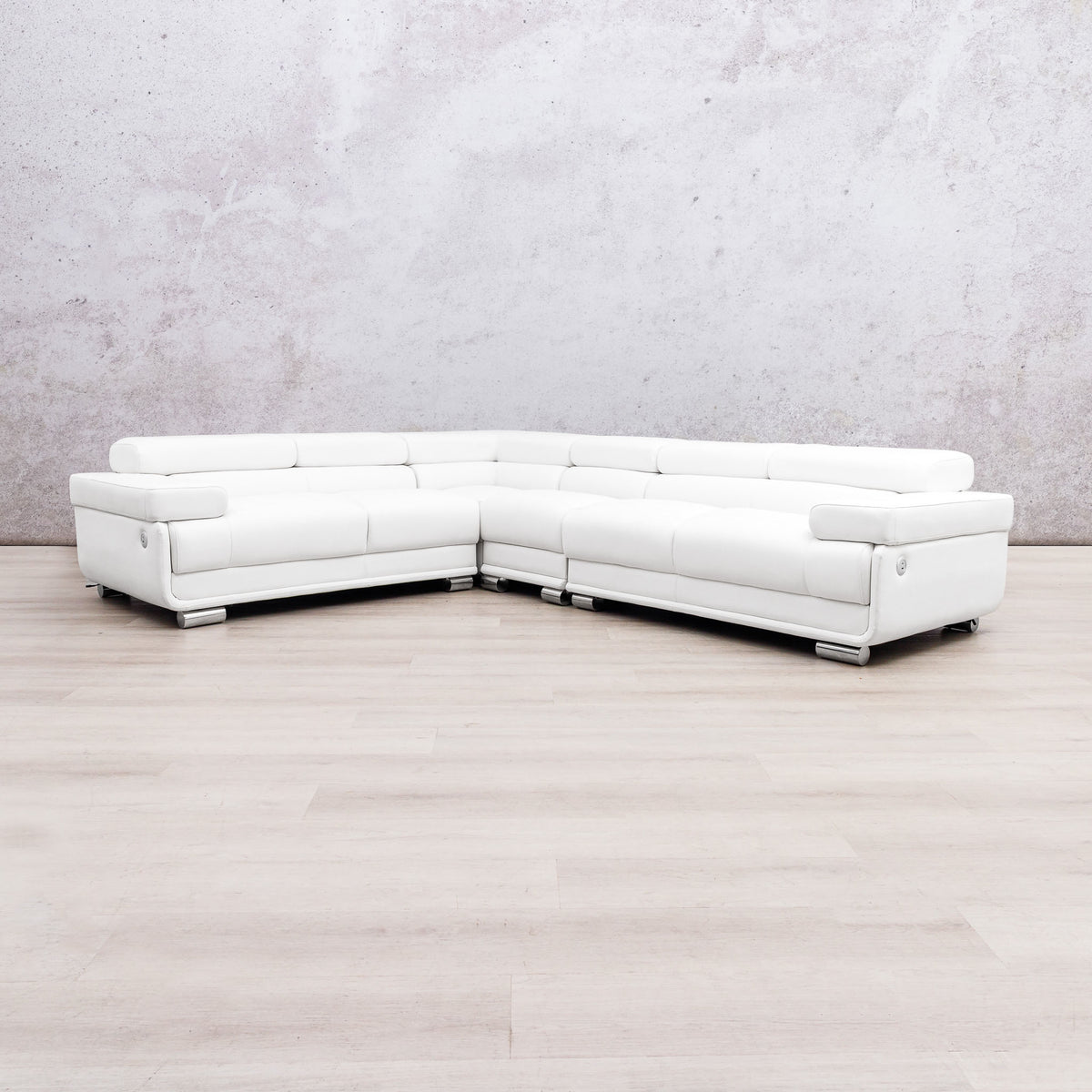 Leather Gallery Tobago 5 Seater L Shape sectional sofa in white leather with a left-facing chaise, against a light grey wall and wood flooring.
