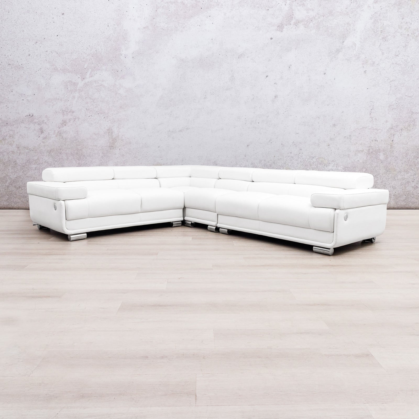 Leather Gallery Tobago 5 Seater L Shape sectional sofa in white leather with a left-facing chaise, against a light grey wall and wood flooring.