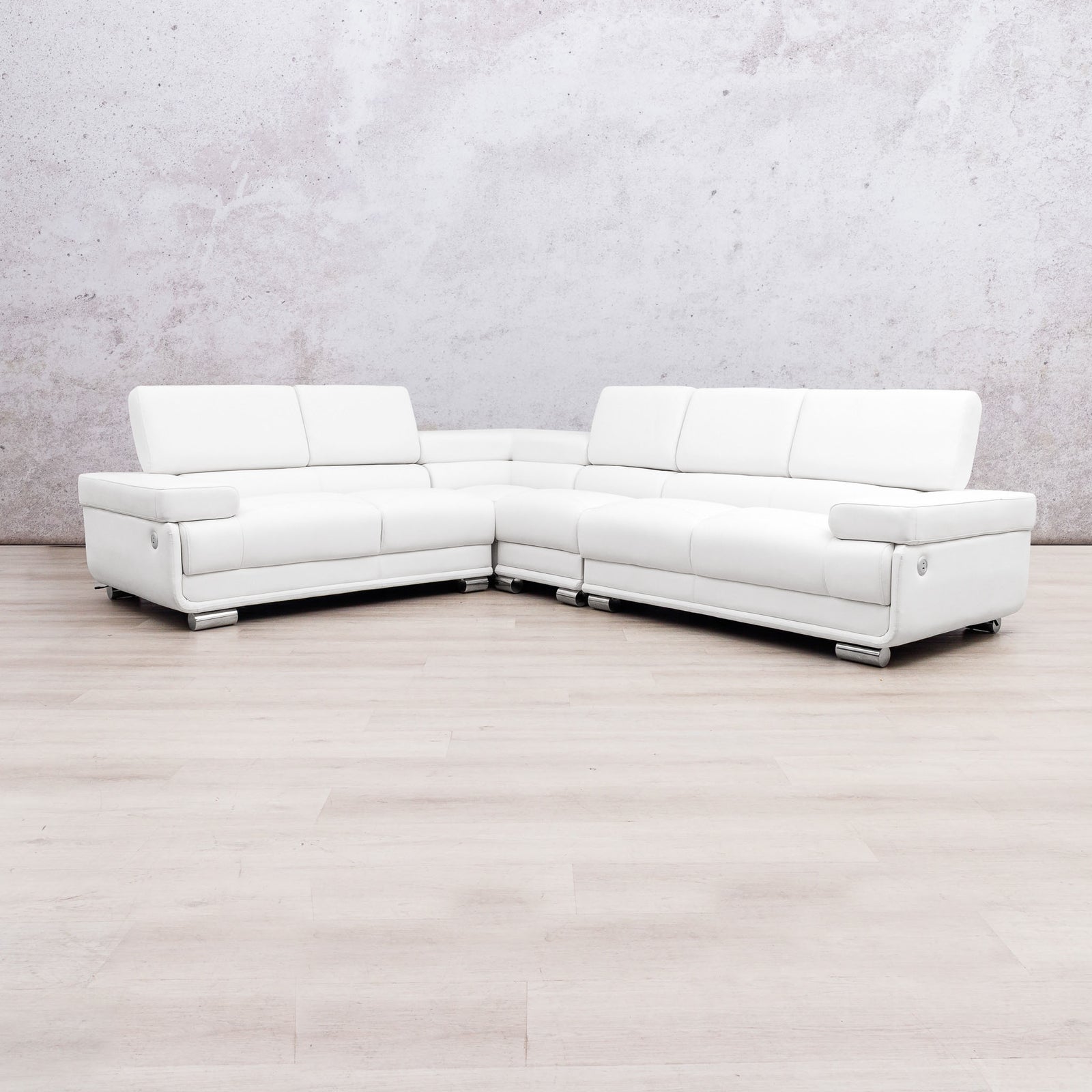 Leather Gallery Tobago 5 Seater L Shape sectional sofa in white leather with a left-facing chaise, against a light grey wall and wood flooring.