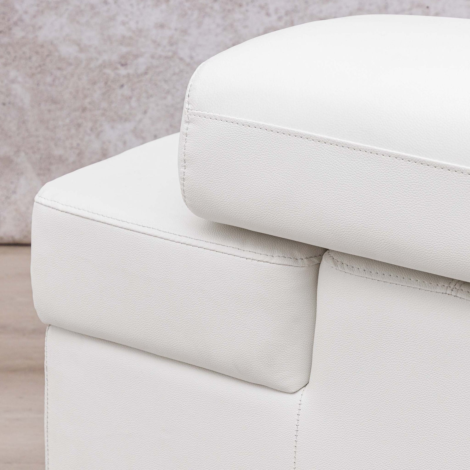 Close-up of the Leather Gallery Tobago 5 Seater L Shape Sectional in white, featuring plush cushions and clean stitching.