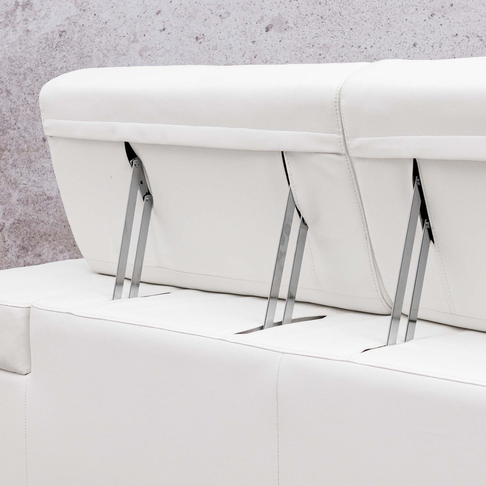 Close-up of the Leather Gallery Tobago 5 Seater L Shape Sectional in white, showing clean stitching and visible metal support legs.