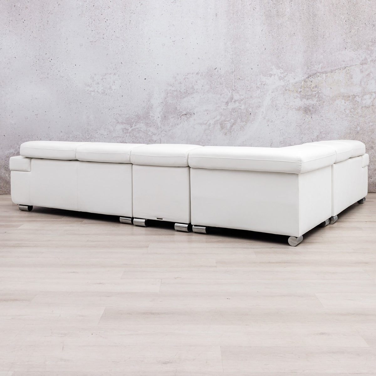 Leather Gallery Tobago 5 Seater L Shape Sectional in white, featuring a low-profile design and silver metal legs.
