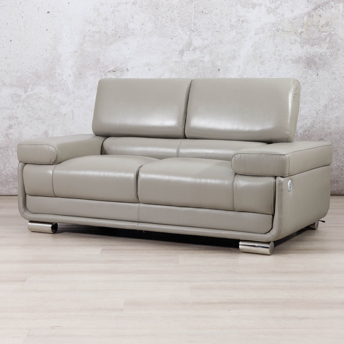 Three-quarter view of the Leather Gallery Tobago 2 Seater Leather Couch in Grey, showing its modern leather upholstery and low-profile design.