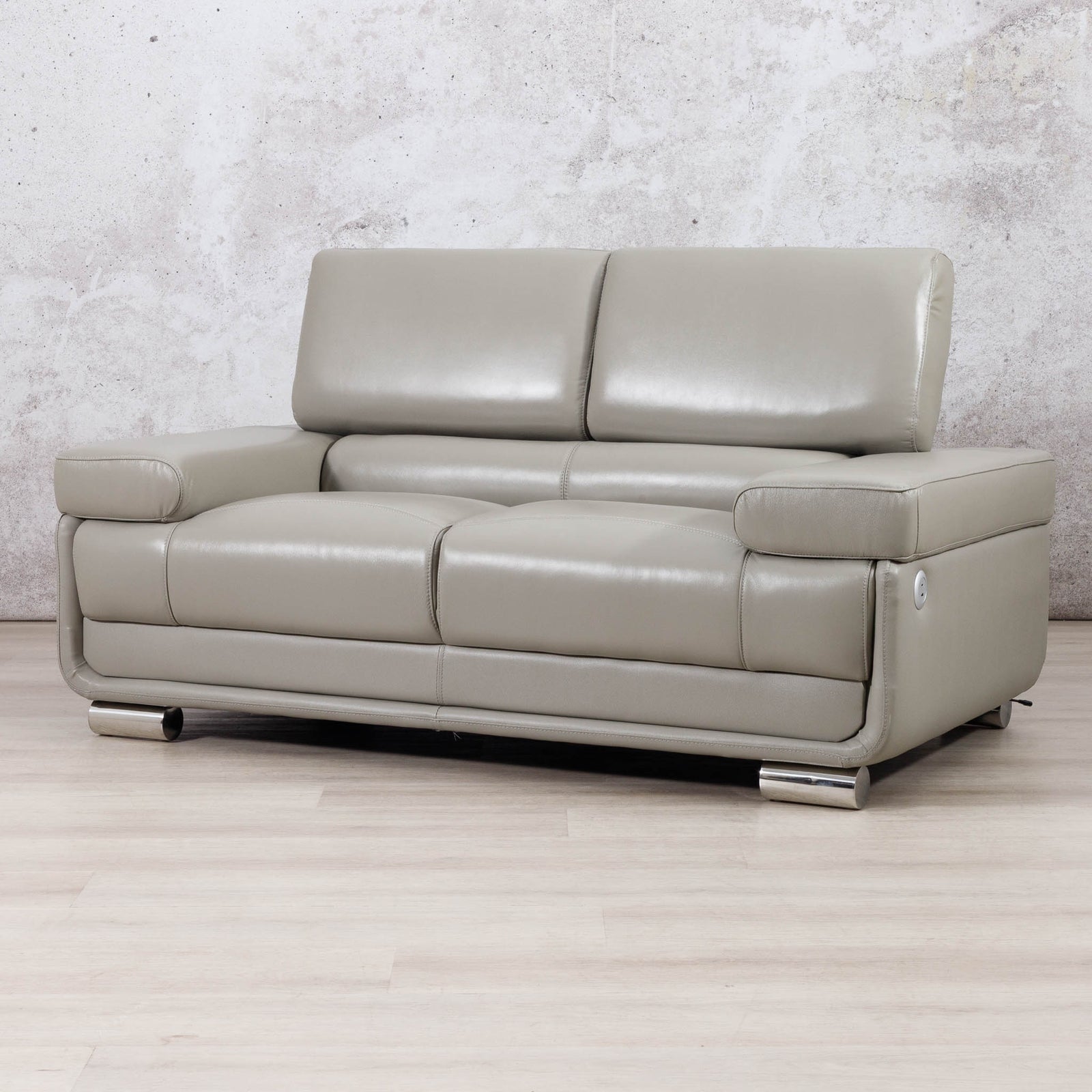 Three-quarter view of the Leather Gallery Tobago 2 Seater Leather Couch in Grey, showing its modern leather upholstery and low-profile design.