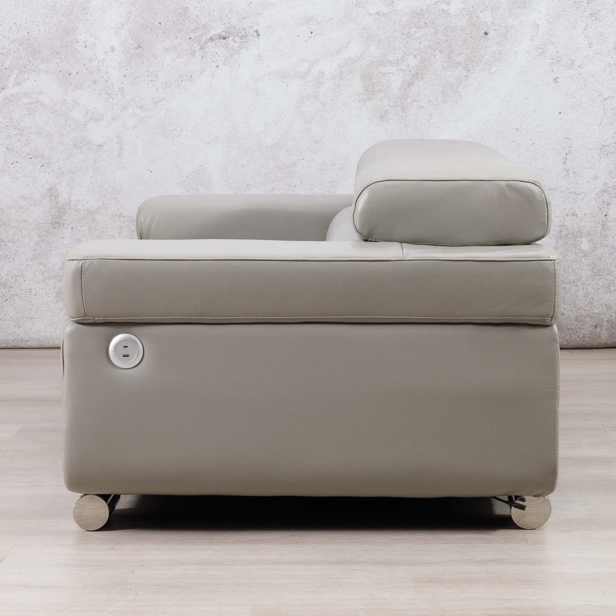 Front view of the Leather Gallery Tobago 2 Seater Leather Couch in Grey, showing the leather upholstery and circular side control button.