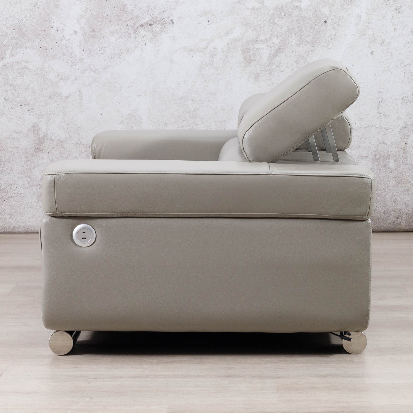 Side view of the Leather Gallery Tobago 2 Seater Leather Couch in Grey, showing the circular side control button and leather upholstery.