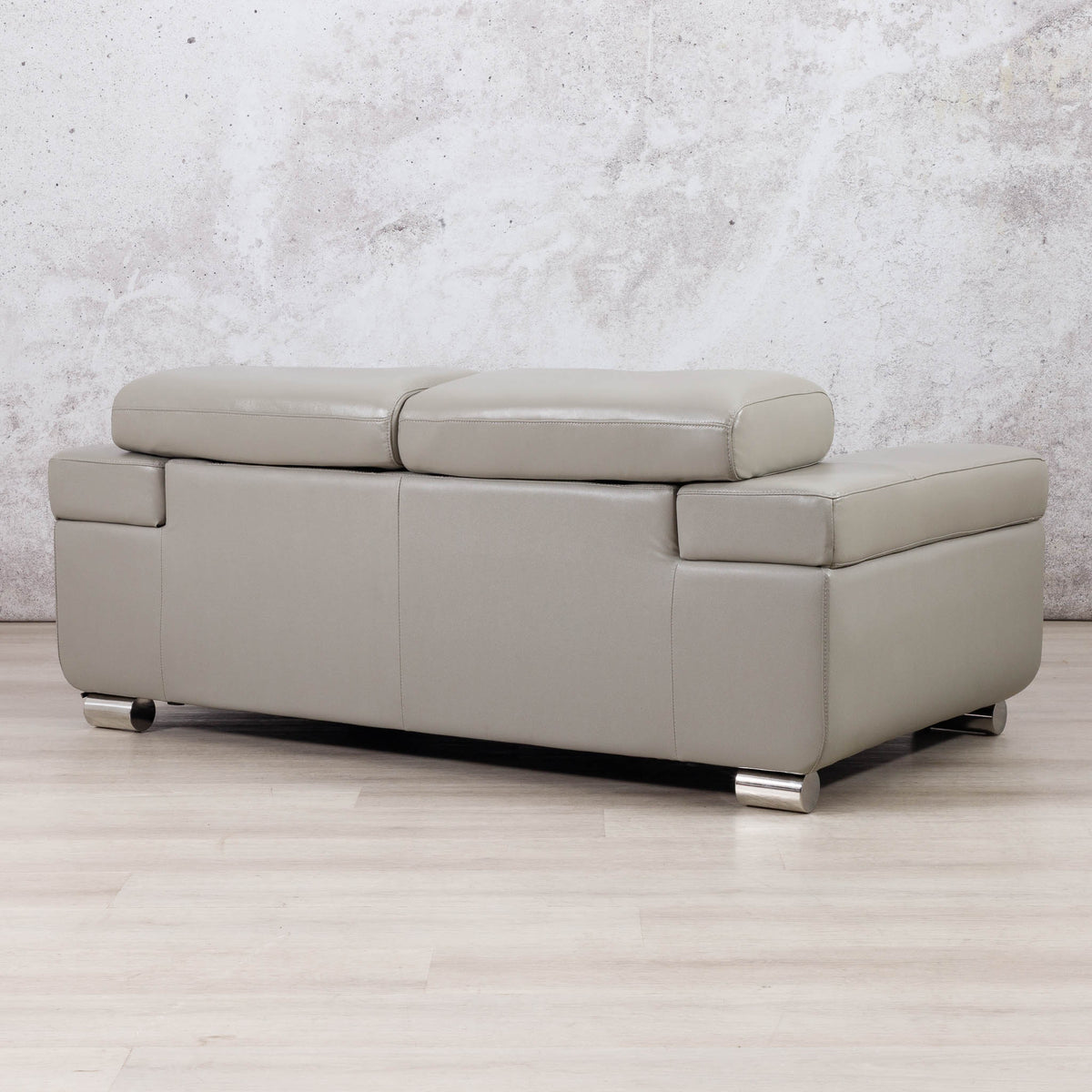 Leather Gallery Tobago 2 Seater Leather Couch in Grey, shown with a low-profile design and chaise-style seating.