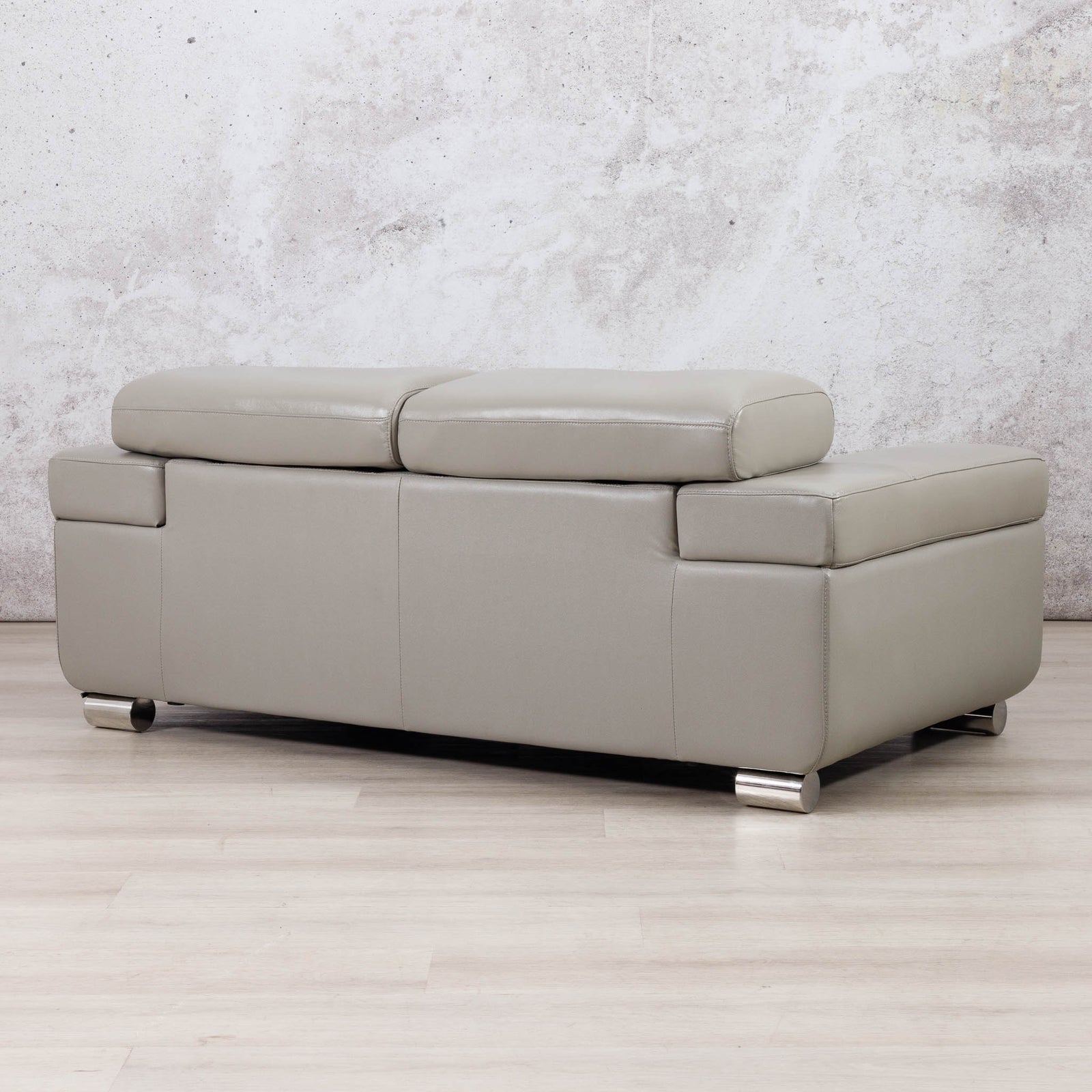 Leather Gallery Tobago 2 Seater Leather Couch in Grey, shown with a low-profile design and chaise-style seating.