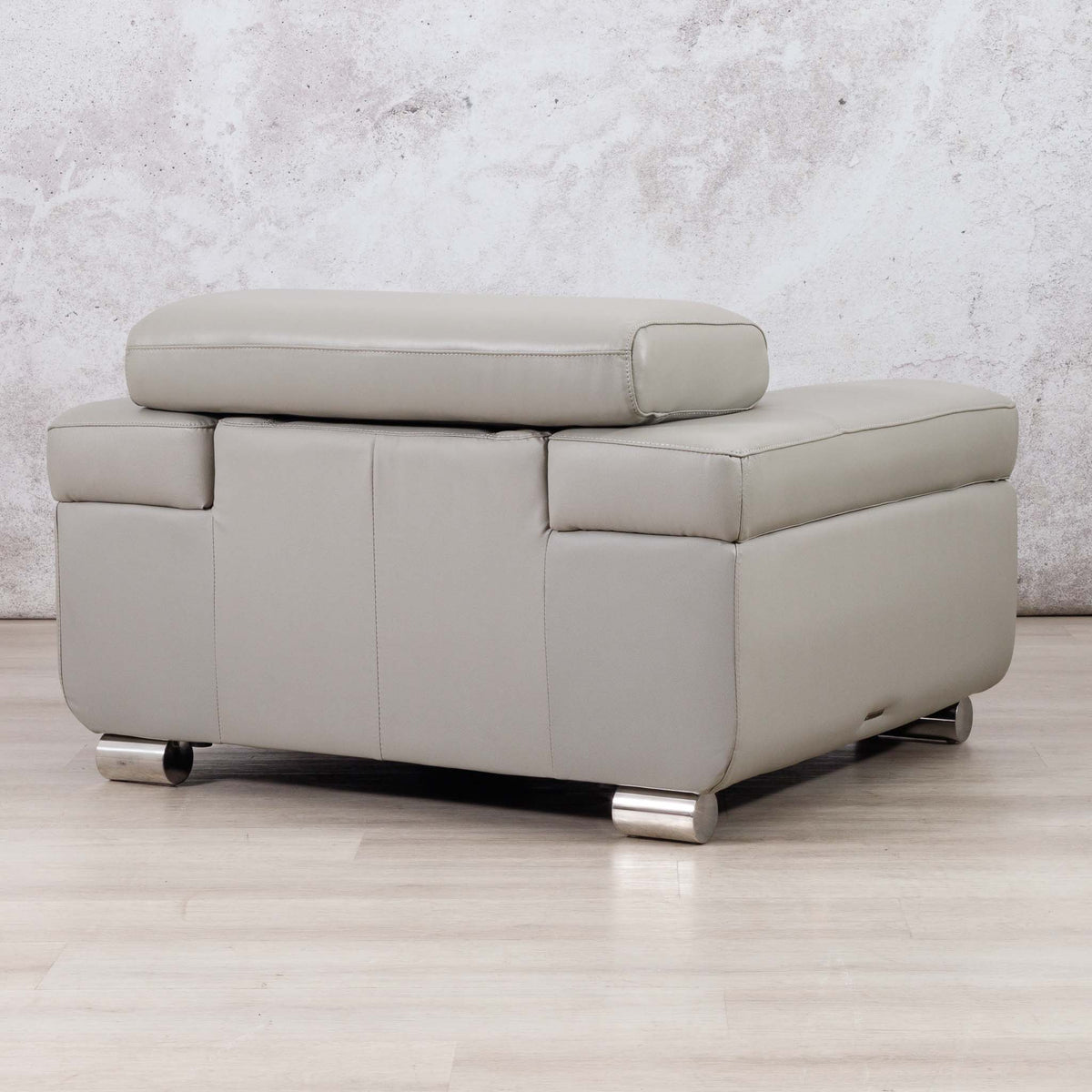 Leather Gallery Tobago 1 Seater Leather Couch in Grey, featuring a raised back cushion and cylindrical metal feet.