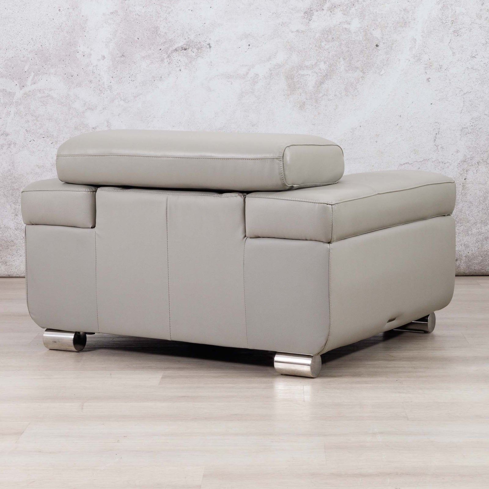 Leather Gallery Tobago 1 Seater Leather Couch in Grey, featuring a raised back cushion and cylindrical metal feet.