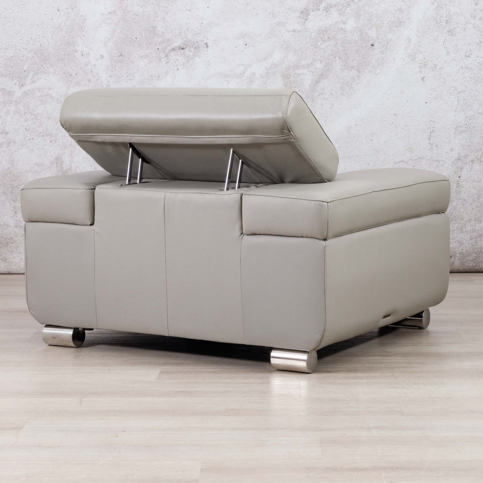 Leather Gallery Tobago 1 Seater Leather Couch in Grey, shown with the seat cushion lifted to reveal the base.