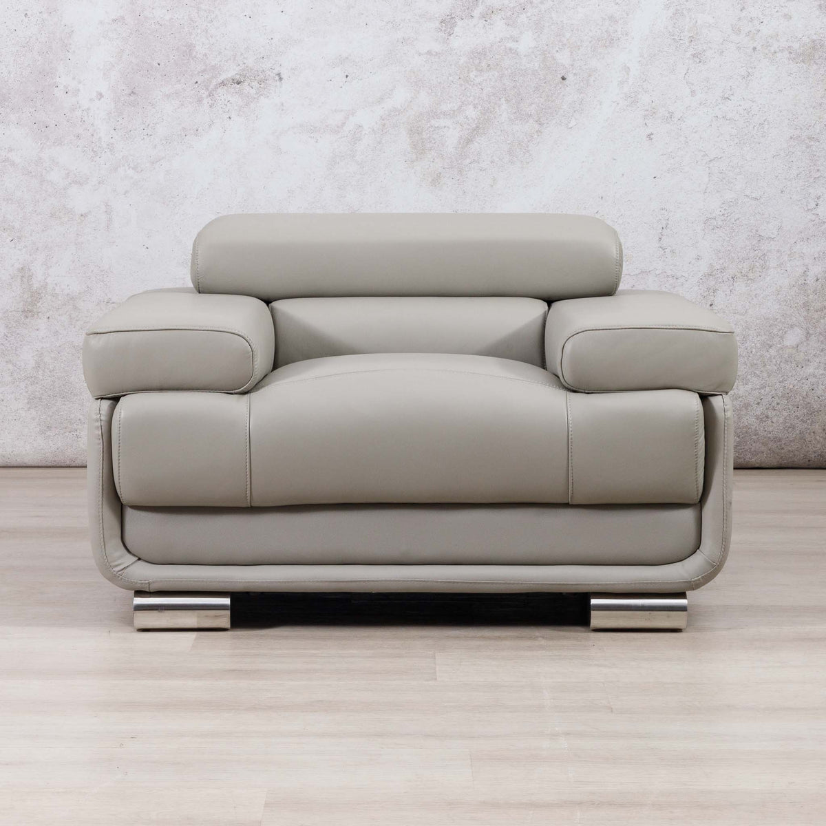 Leather Gallery Tobago 1 Seater Leather Couch in Grey, featuring polished chrome legs and a modern low-profile design.