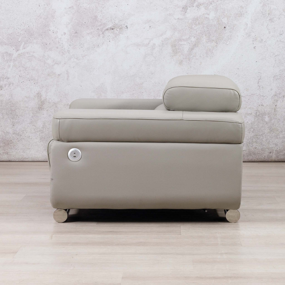Side view of the Leather Gallery Tobago 1 Seater Leather Couch in Grey, featuring a matching headrest pillow and smooth leather upholstery.
