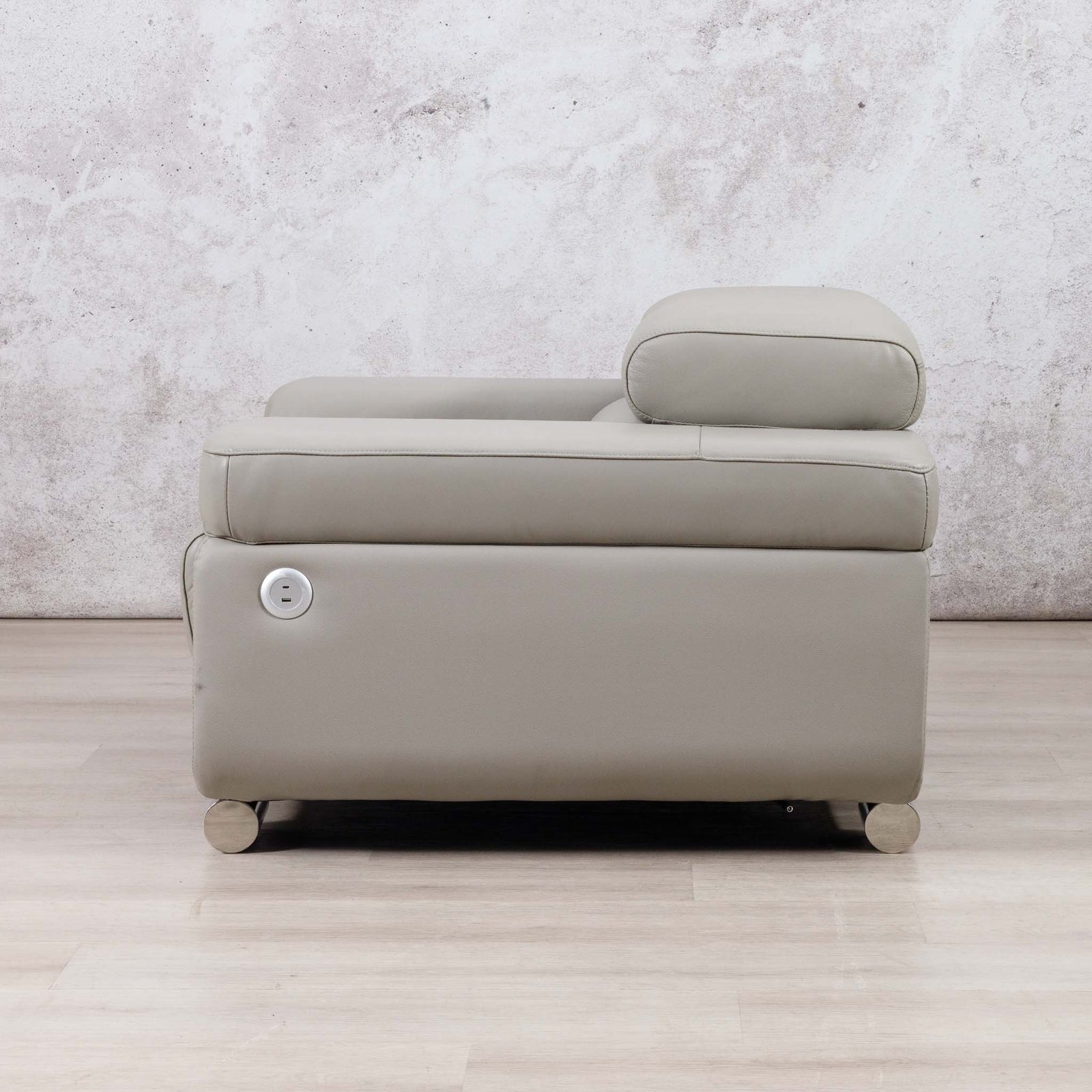 Side view of the Leather Gallery Tobago 1 Seater Leather Couch in Grey, featuring a matching headrest pillow and smooth leather upholstery.