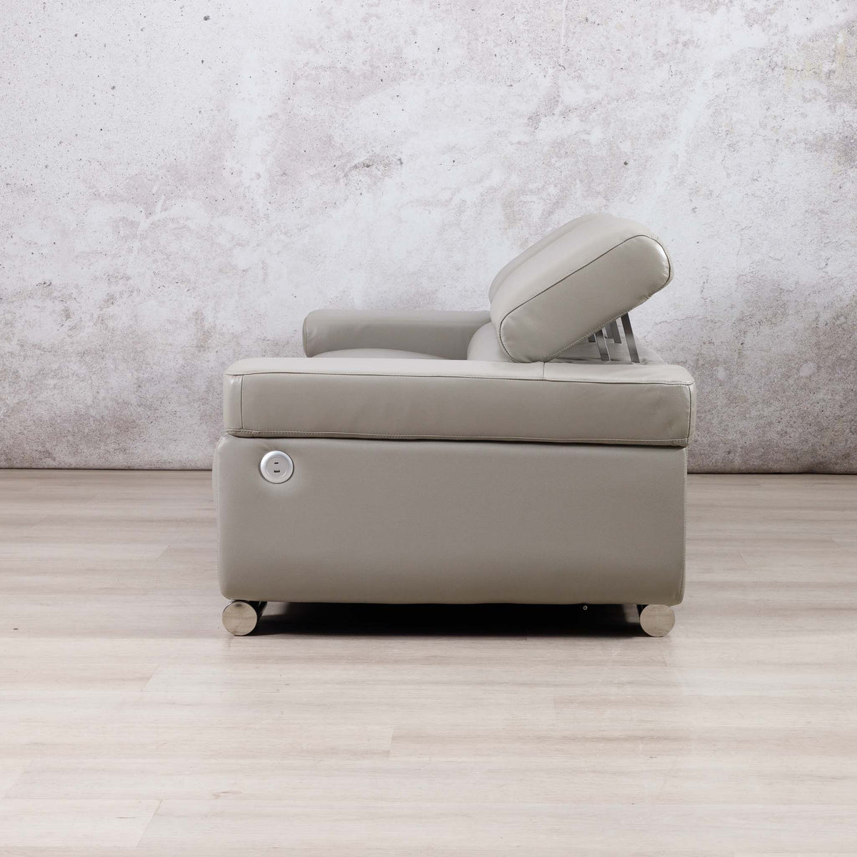 Side view of the Leather Gallery Tobago 3 Seater Leather Couch in Grey, showing the raised headrest and sleek leather profile.