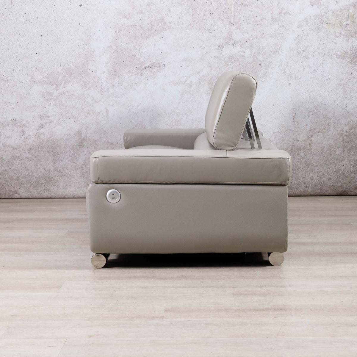 Side view of the Leather Gallery Tobago 3 Seater Leather Couch in Grey, showing the high backrest and circular side control.
