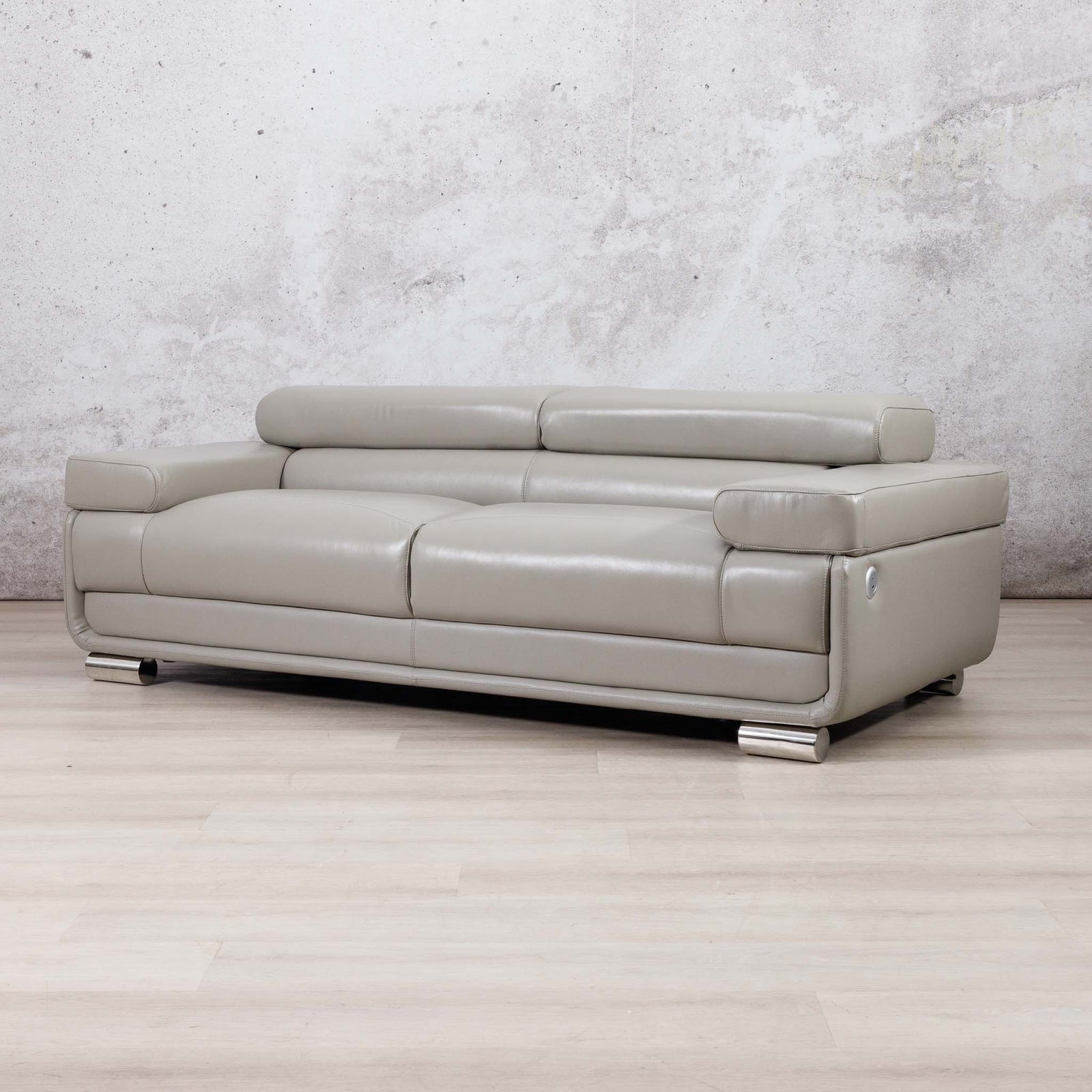 Leather Gallery Tobago 3 Seater Leather Couch in Grey, featuring light leather upholstery and polished silver metal legs.