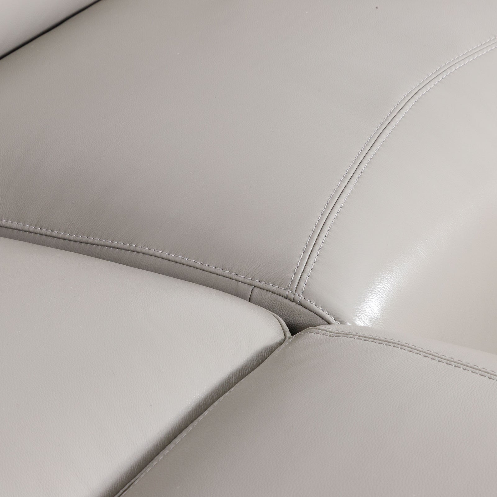 Close-up of the Leather Gallery Tobago 5 Seater Leather L Shape Couch in Grey, showing smooth leather texture and stitched panel seams.
