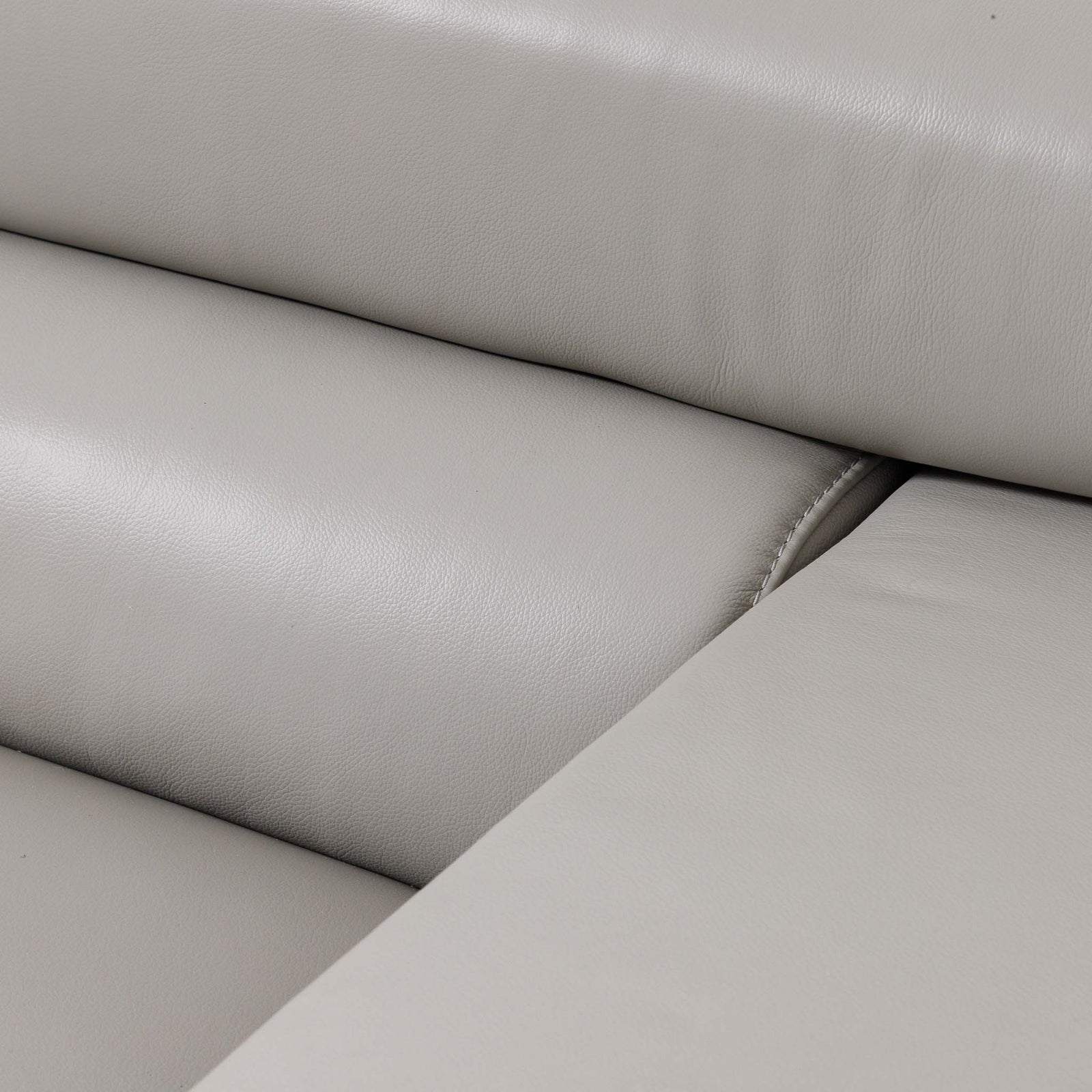 Close-up of the Leather Gallery Tobago 5 Seater Leather L Shape Couch in Grey, showing padded seat and back cushions with stitched seams.