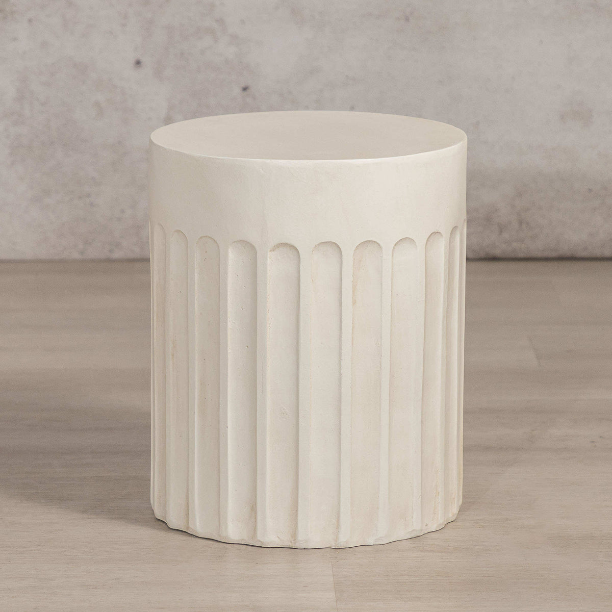 Gallery Everyday Travolta Side Table in Aruba Sand, featuring a cylindrical fluted design in a warm cream finish.