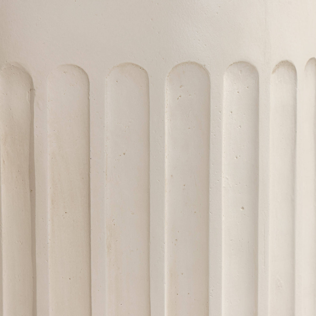 Gallery Everyday Travolta Side Table in Aruba Sand, featuring a cylindrical fluted design in a warm cream finish.