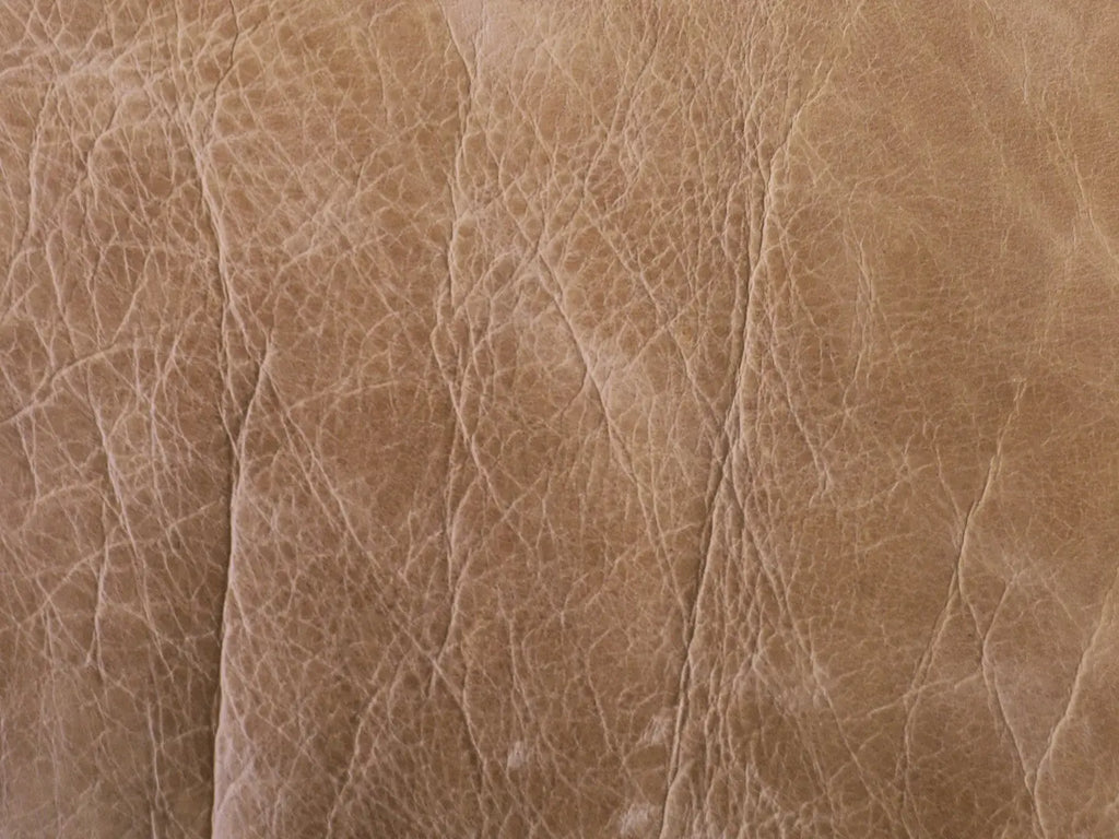 Image of premium leather with visible vein marks, reflecting artisanal craftsmanship.