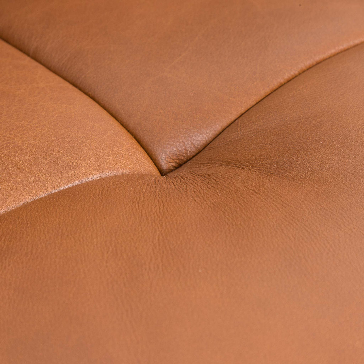 Close-up of the Leather Gallery Zuri 1 Seater Leather Couch in Czar Pecan, showing stitched paneling and natural leather grain.