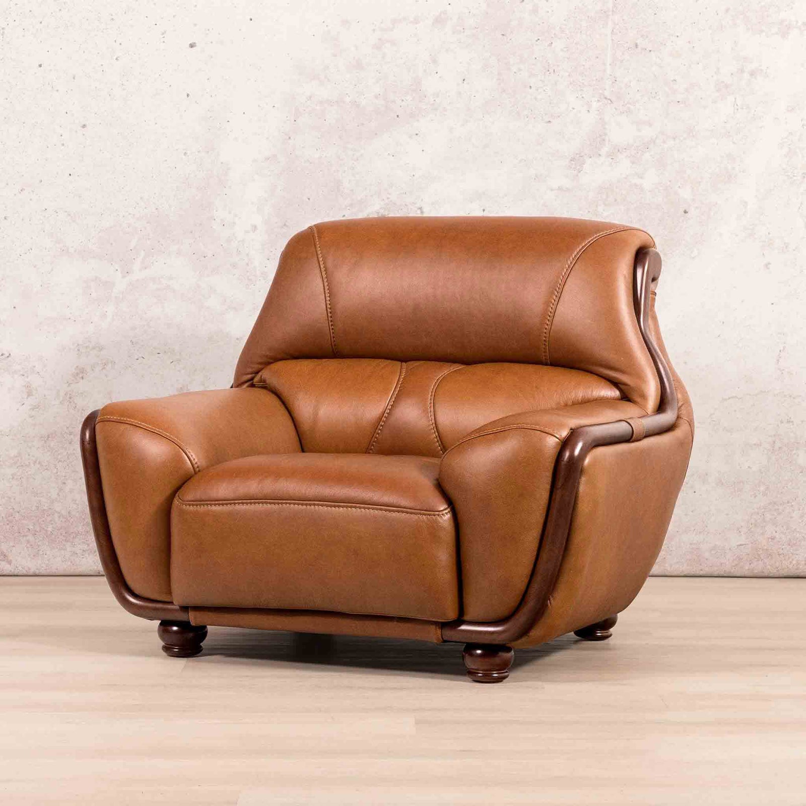 Leather Gallery Zuri 1 Seater Leather Couch in Czar Pecan, featuring dark wood trim and legs.