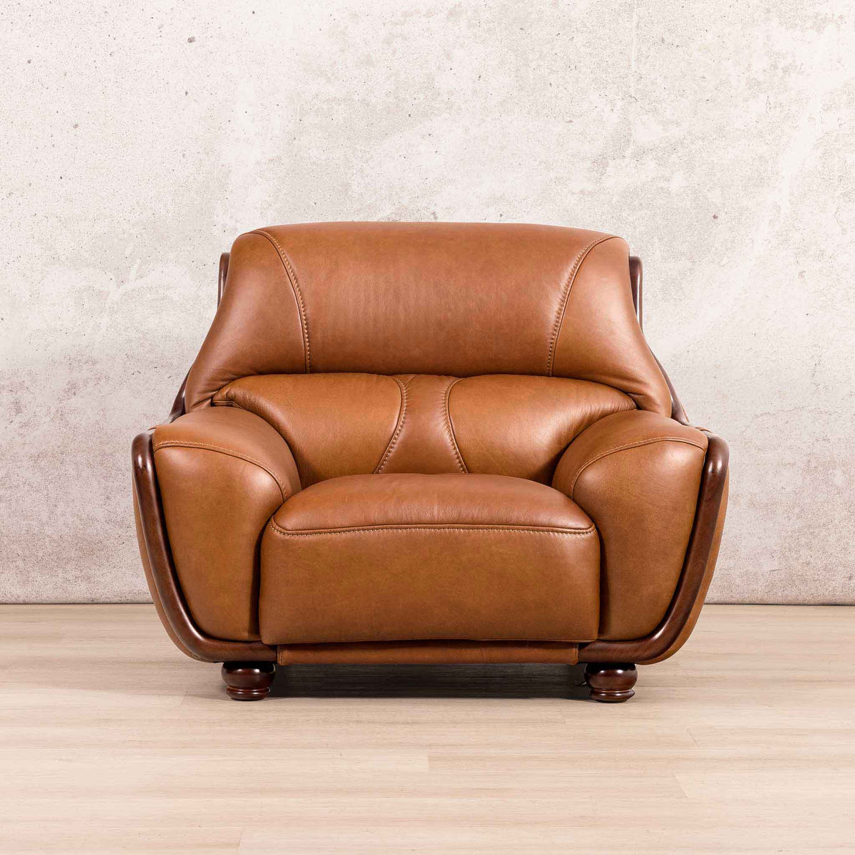 Leather Gallery Zuri 1 Seater Leather Couch in Czar Pecan, featuring dark wood legs and a modern armchair design.