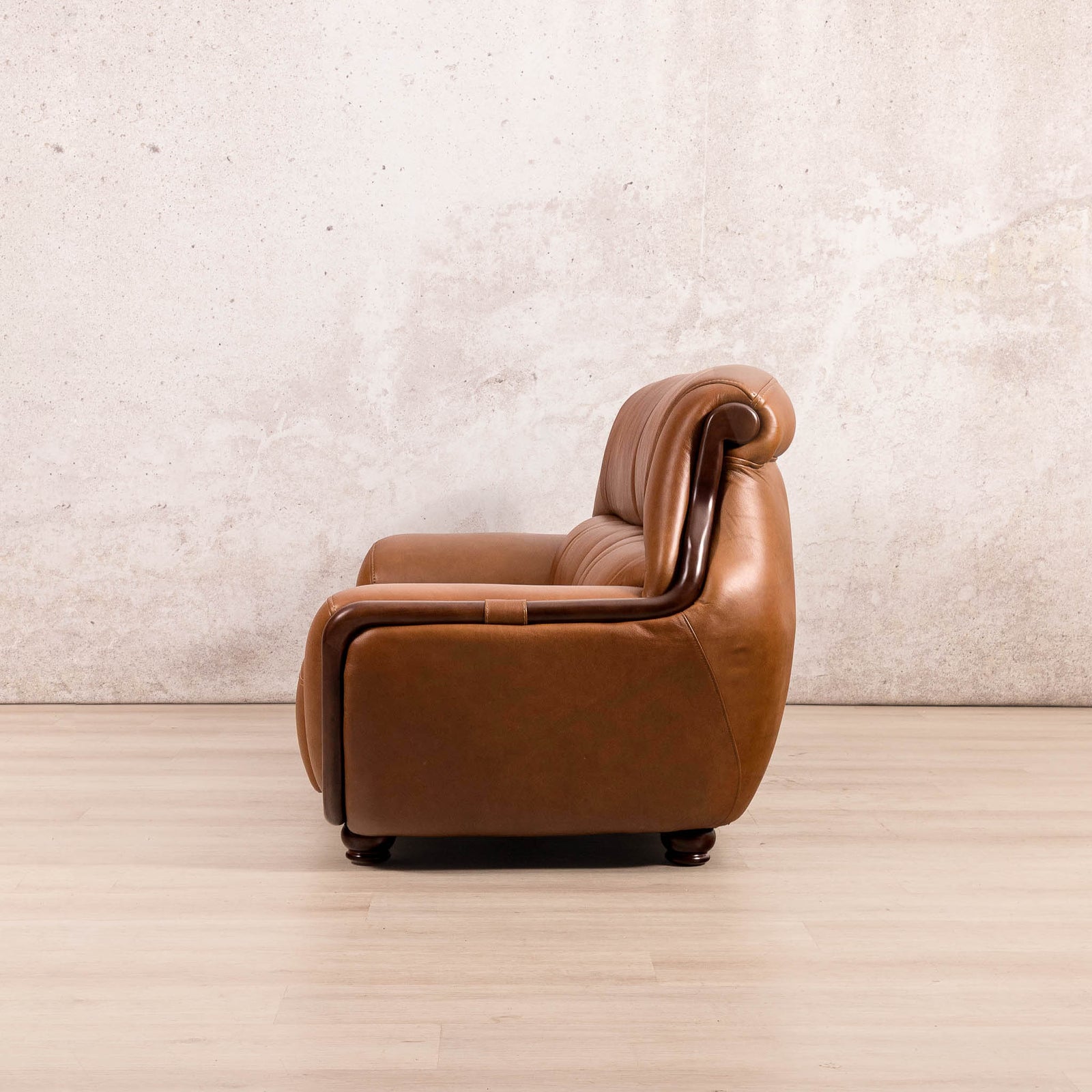 Side view of the Leather Gallery Zuri 3 Seater Leather Couch in Czar Pecan, showing its rounded low-profile design.