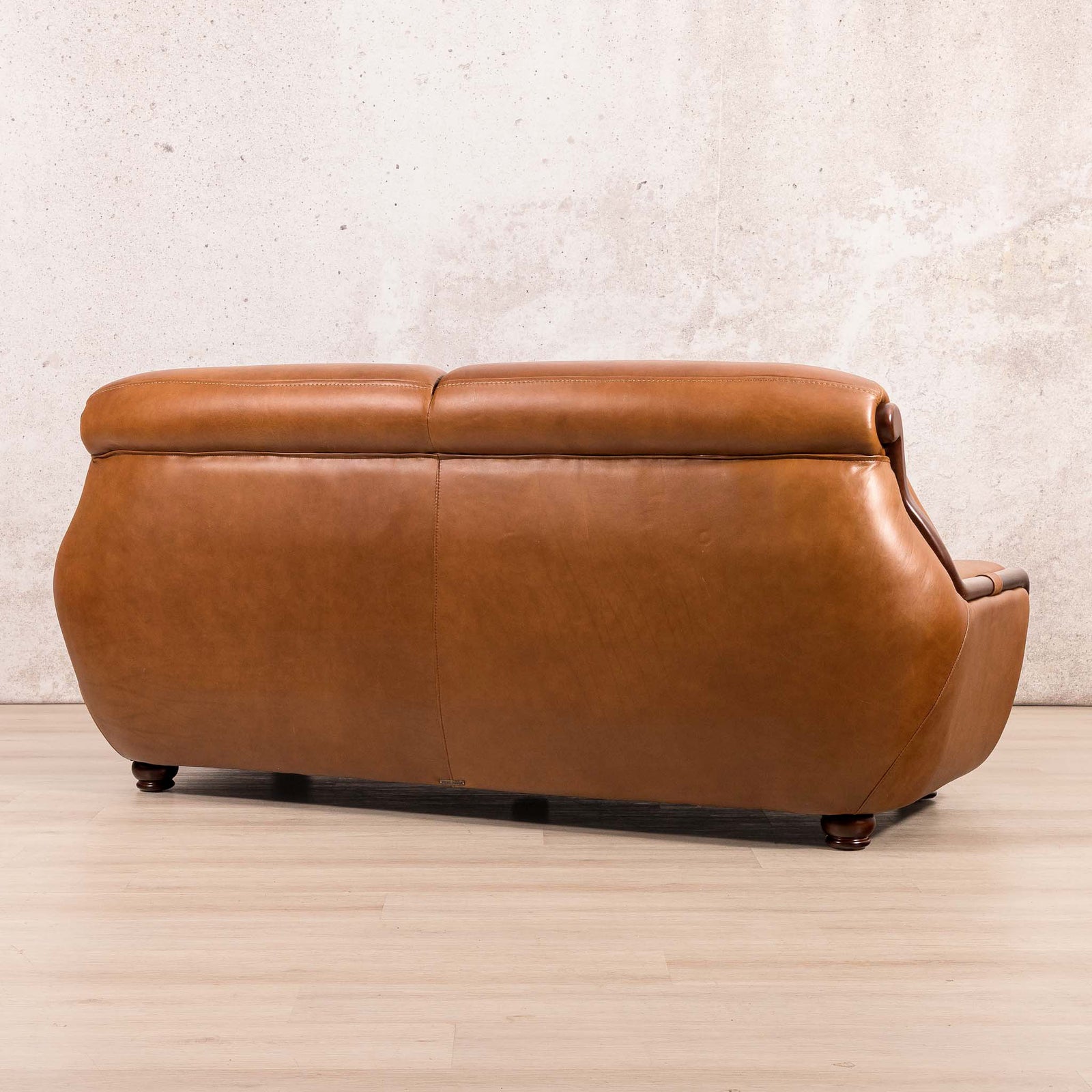 Side view of the Leather Gallery Zuri 3 Seater Leather Couch in Czar Pecan, showing its warm leather upholstery and low-profile design.