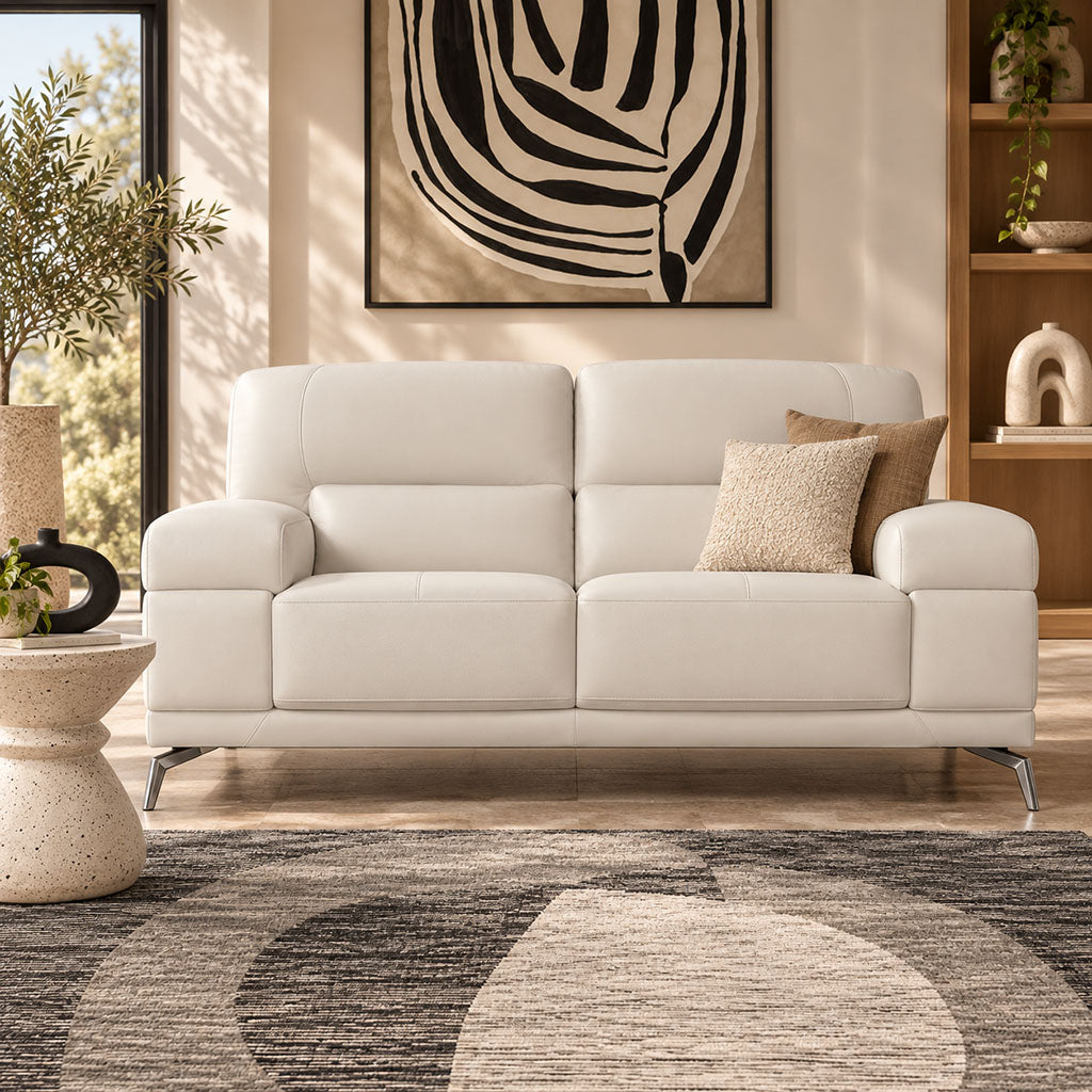 Leather Gallery Adaline 2 Seater Leather Couch in Urban White, featuring cream leather upholstery and decorative cushions in a modern living room.