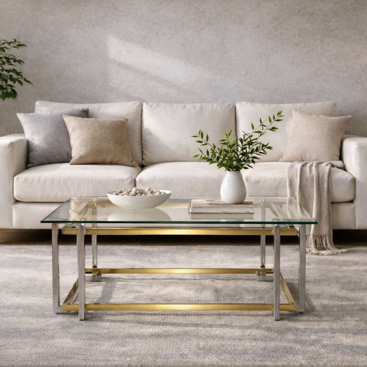 Leather Gallery Arabella Coffee Table, featuring a glass top styled with decorative accents in a modern living room.