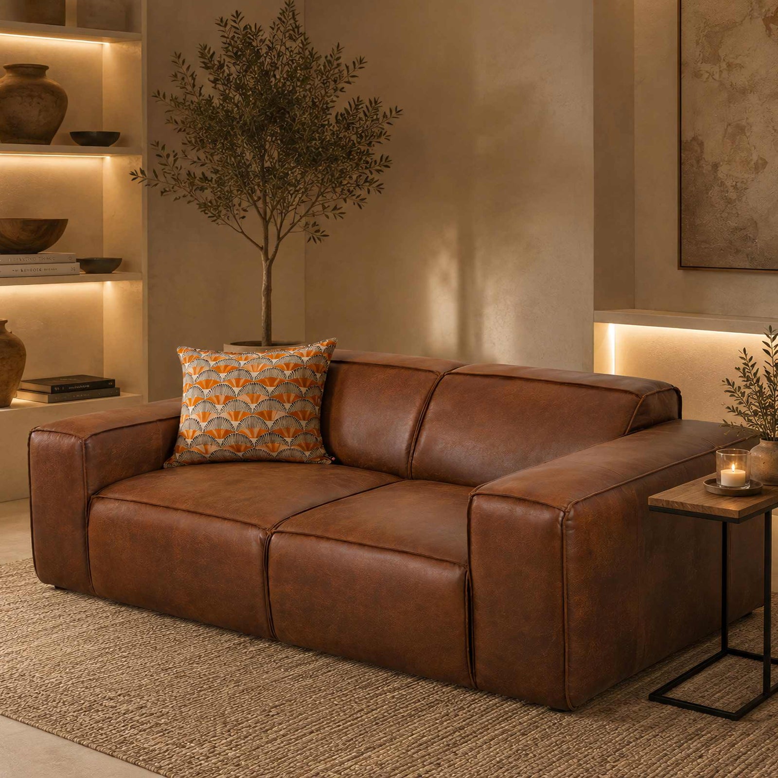 Leather Gallery Austin 3 Seater Leather Couch in Woodlands Spice, styled in a warm modern living room with a patterned cushion and side table.