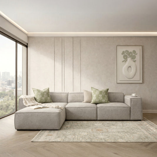 Leather Gallery Austin Fabric Sofa Chaise Sectional in Bordeaux Grey, styled with decorative cushions in a modern living room.
